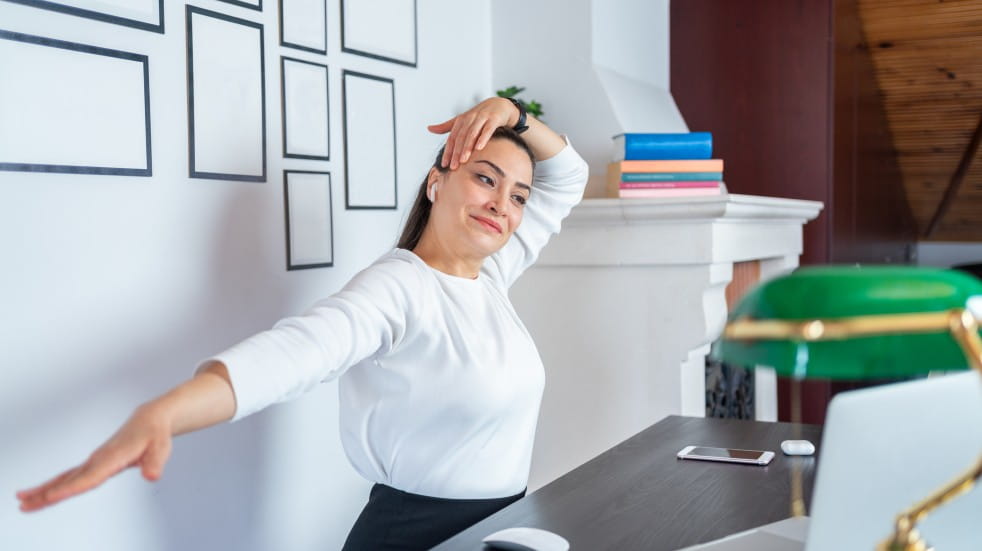 woman doing neck exercise at desk
